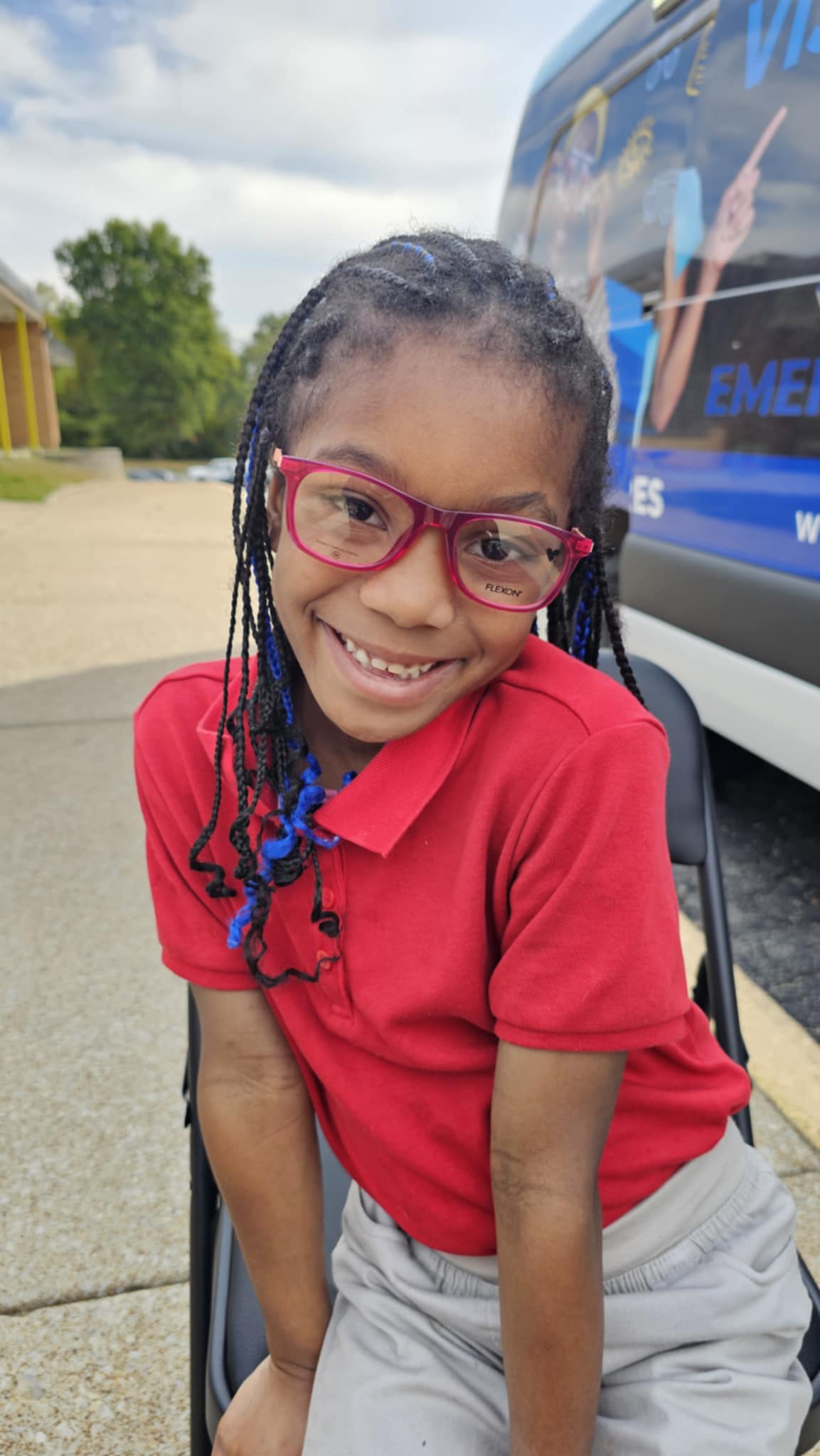 A Kids Vision for Life student inside a mobile vision clinic